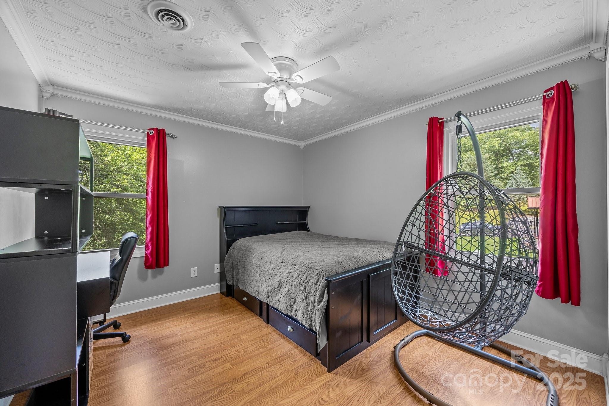 64 Christopher Lane Sylva, NC 28779 - Photo 19 of 31 a bedroom with bed and a chandelier