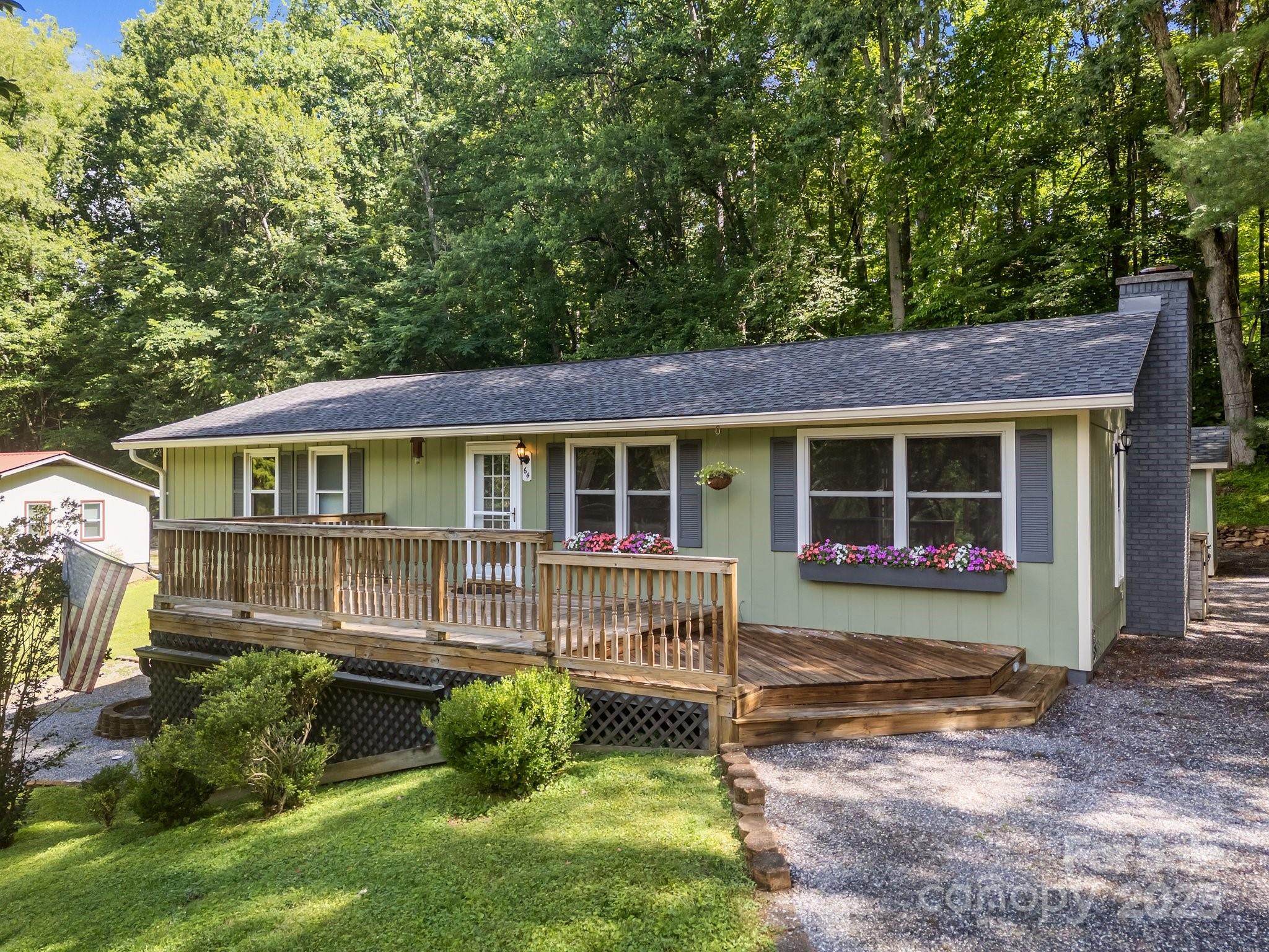 64 Christopher Lane Sylva, NC 28779 - Photo 2 of 31 a front view of a house with garden