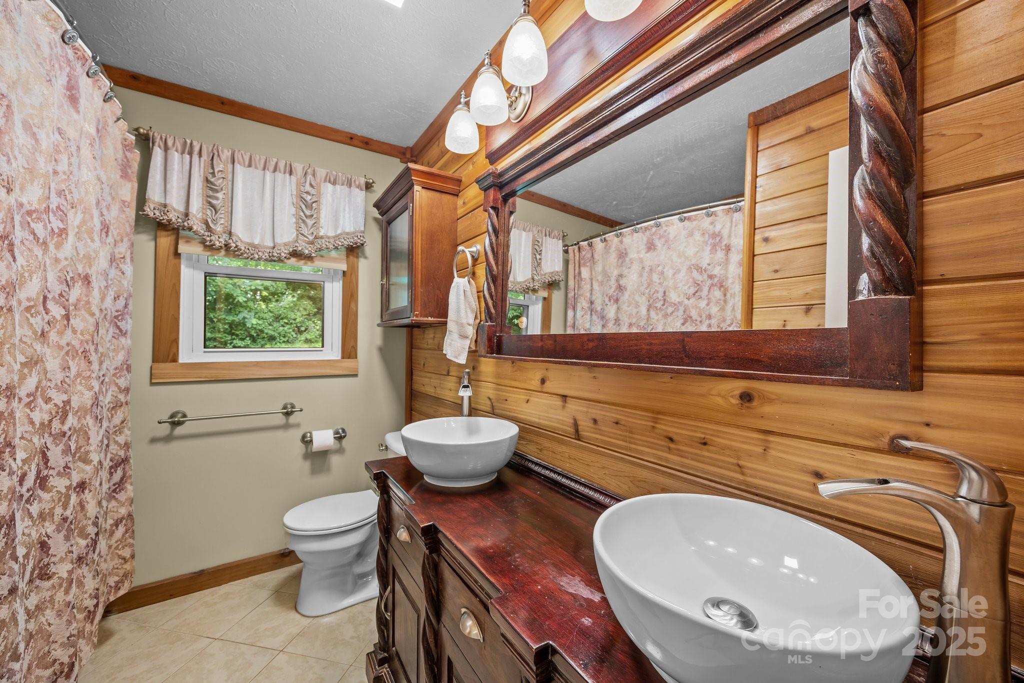 64 Christopher Lane Sylva, NC 28779 - Photo 23 of 31 a bathroom with a toilet sink and mirror