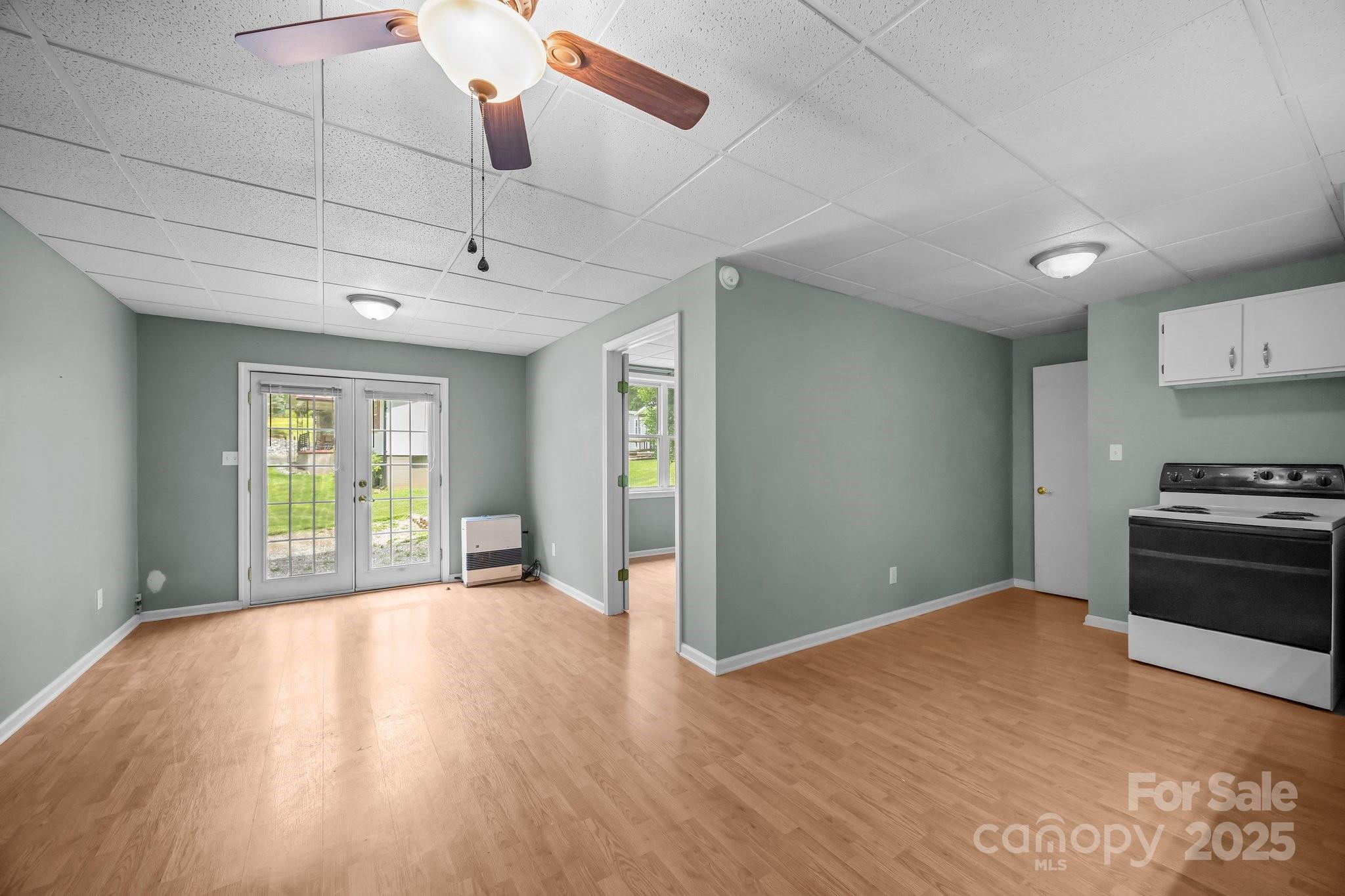 64 Christopher Lane Sylva, NC 28779 - Photo 25 of 31 a view of a kitchen with wooden floor a ceiling fan and windows