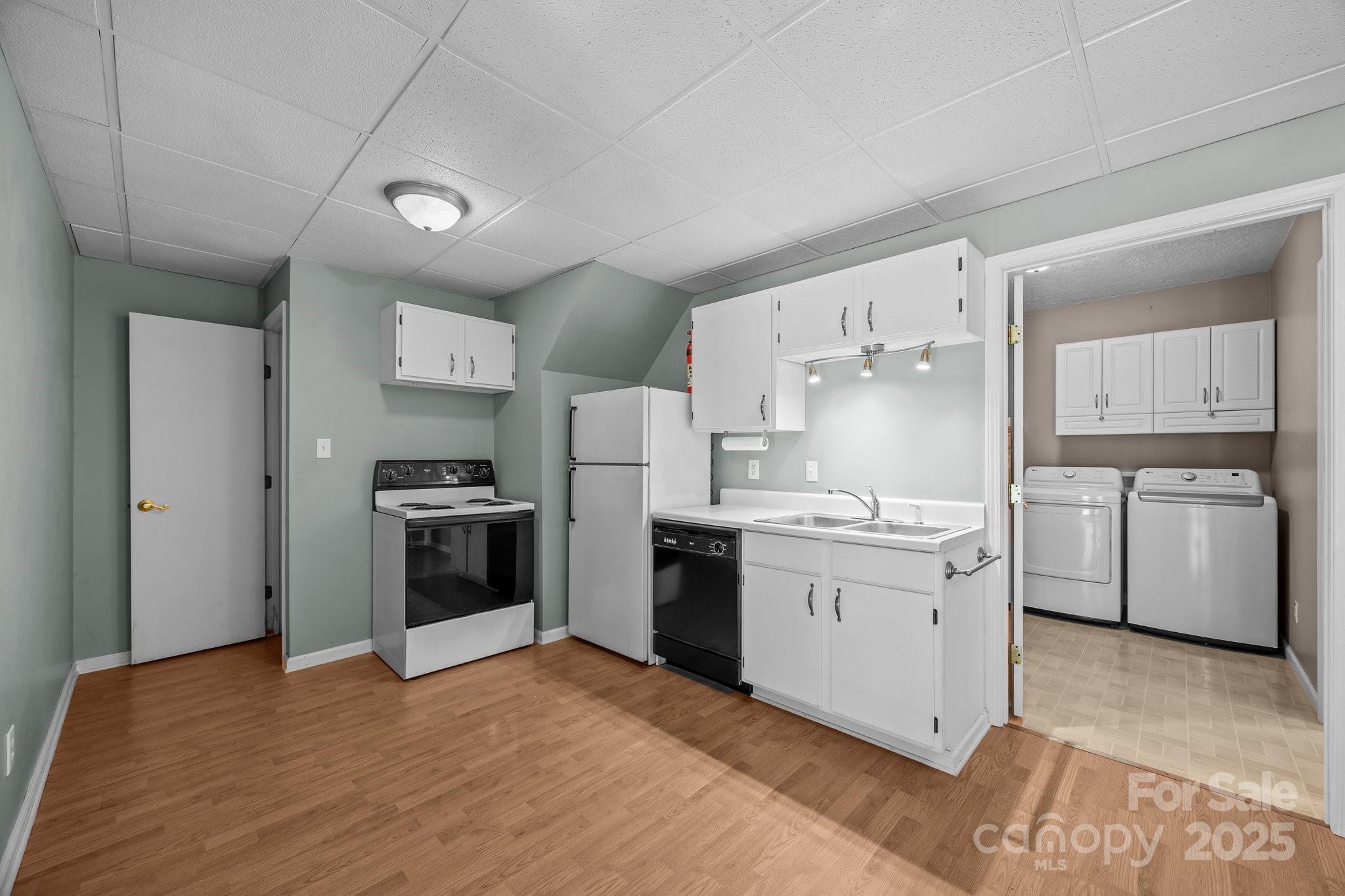 64 Christopher Lane Sylva, NC 28779 - Photo 27 of 31 a kitchen with a white cabinets and white appliances