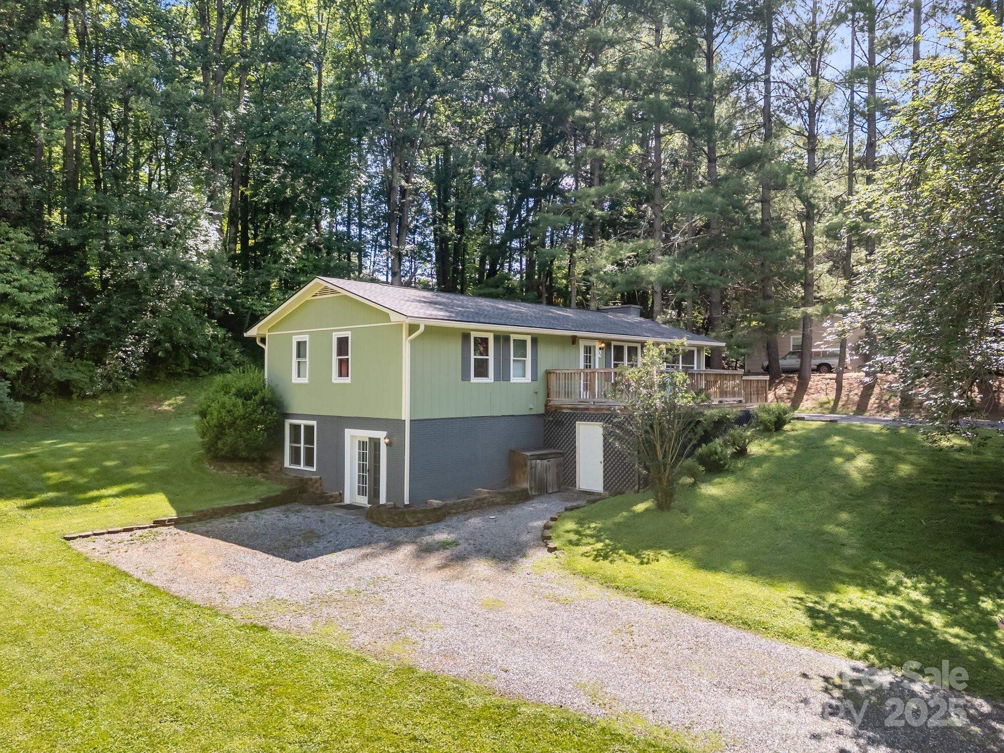 64 Christopher Lane Sylva, NC 28779 - Photo 4 of 31 a front view of house with yard and green space