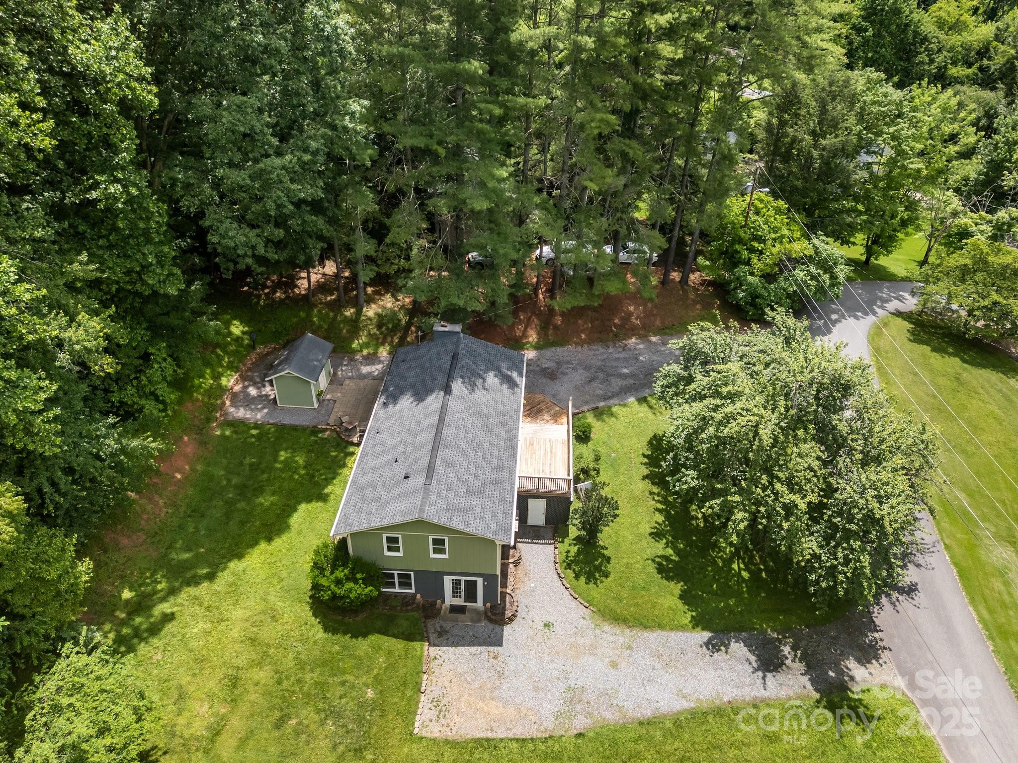 64 Christopher Lane Sylva, NC 28779 - Photo 5 of 31 an aerial view of a house with a yard