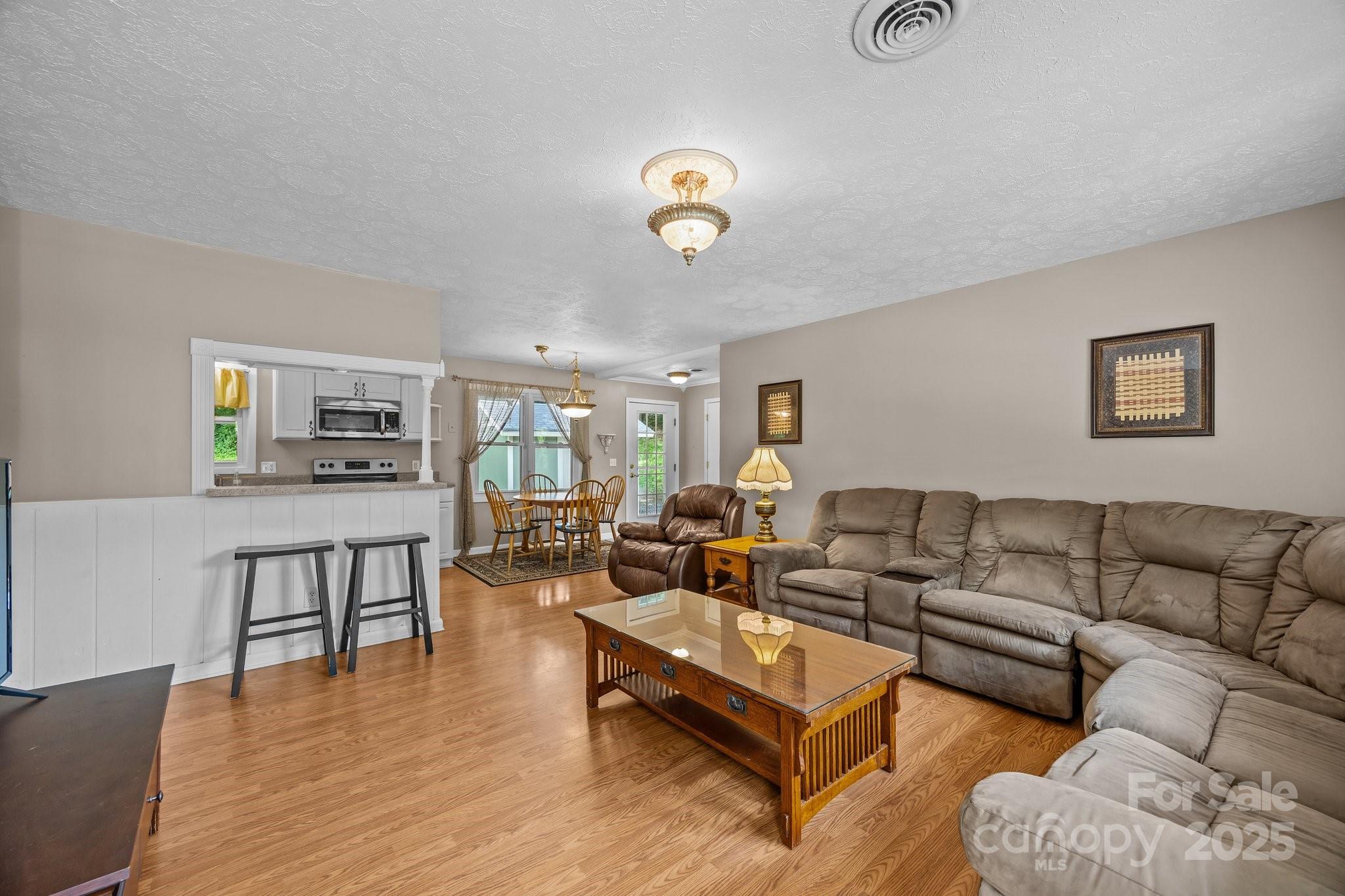 64 Christopher Lane Sylva, NC 28779 - Photo 10 of 31 a living room with furniture a rug and a window
