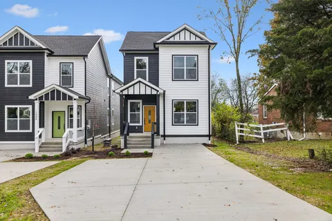 a front view of a house with swimming pool and sitting area