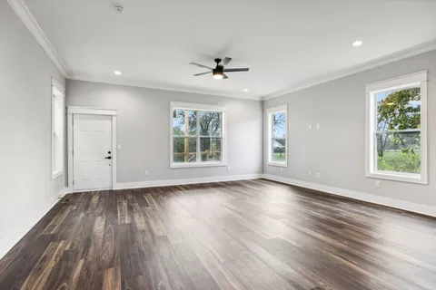 a view of kitchen with granite countertop cabinets and outdoor space
