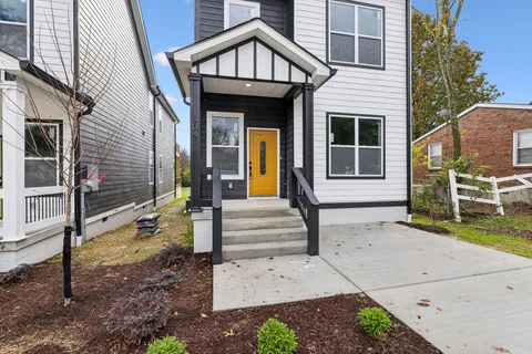 a kitchen with stainless steel appliances sink refrigerator and cabinets