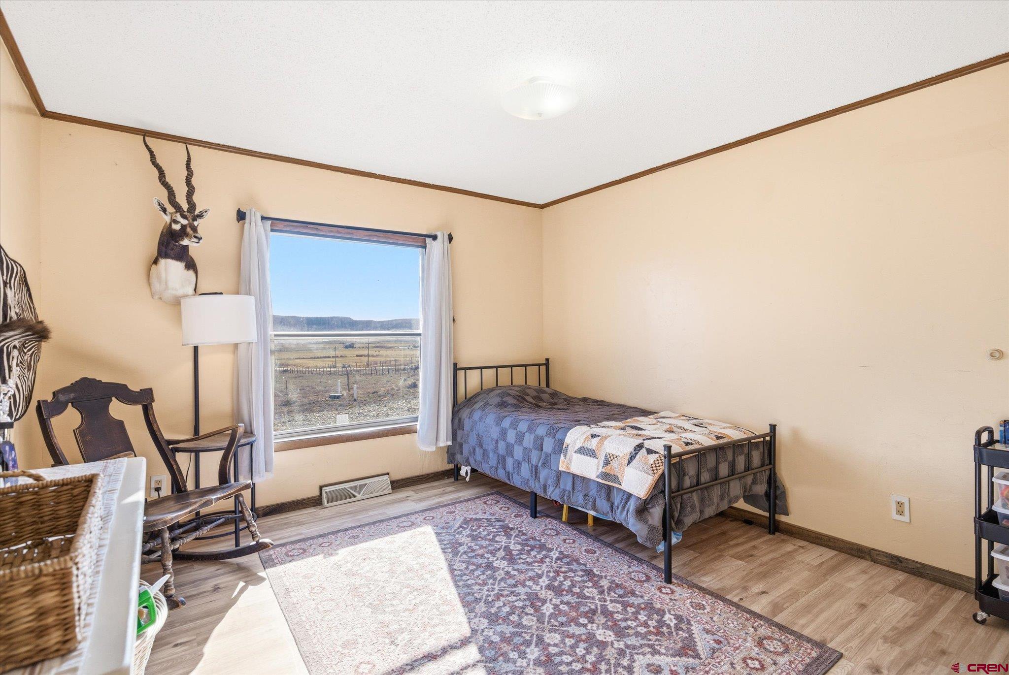 1966 County Road 321 Ignacio, CO 81137 - Photo 12 of 26 a bedroom with a bed and a large window