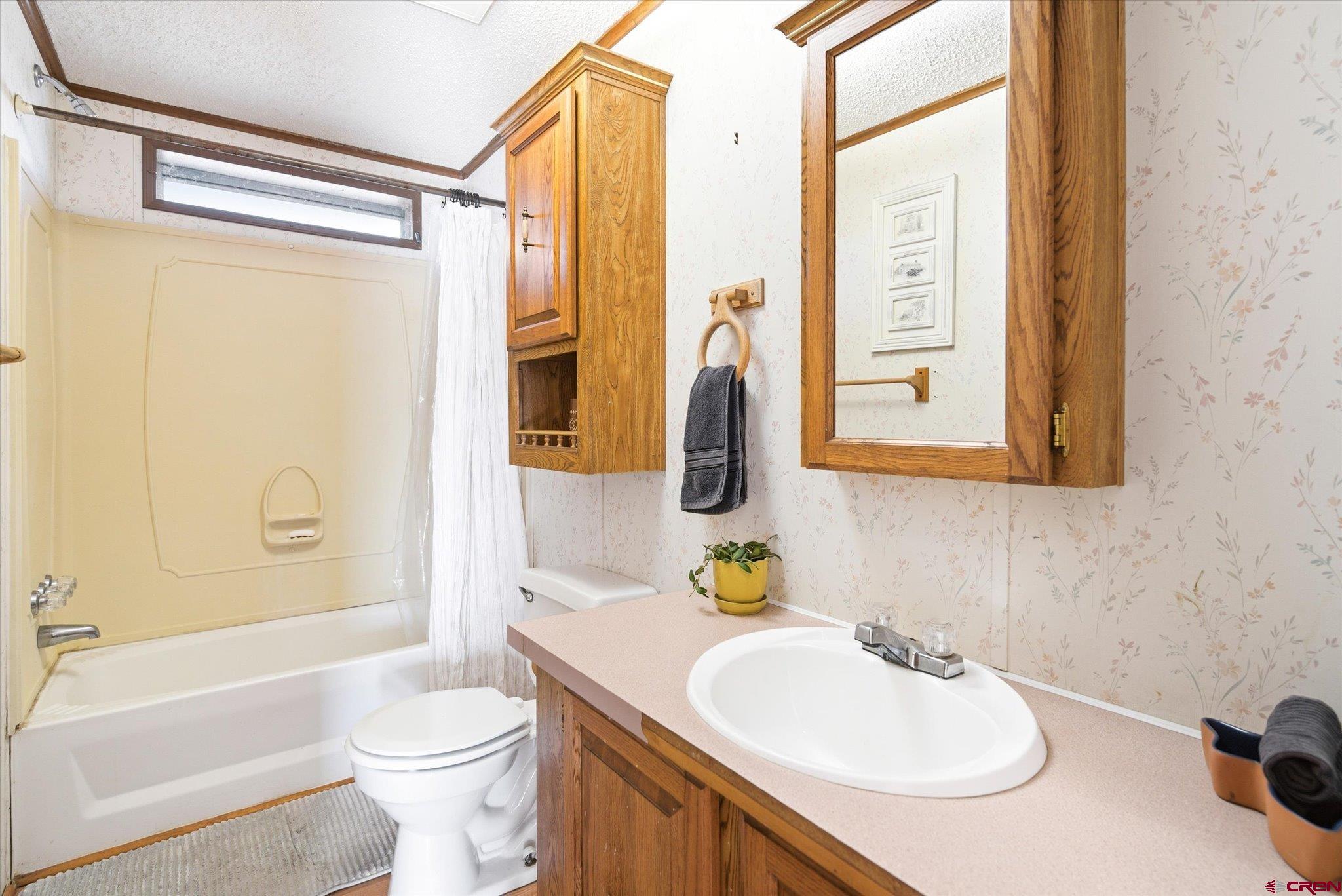 1966 County Road 321 Ignacio, CO 81137 - Photo 14 of 26 a bathroom with a sink toilet and shower