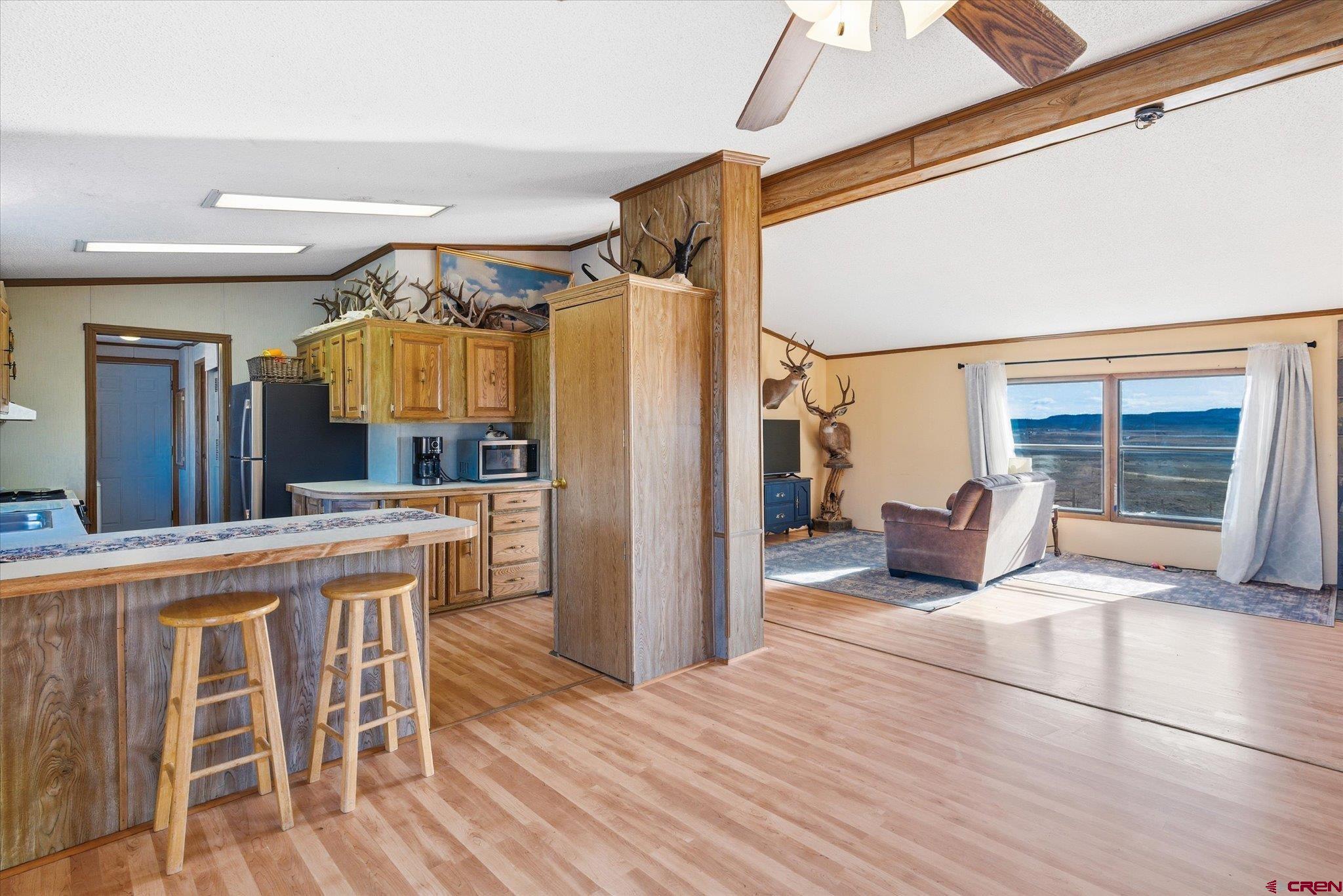 1966 County Road 321 Ignacio, CO 81137 - Photo 6 of 26 a large kitchen with a table and chairs