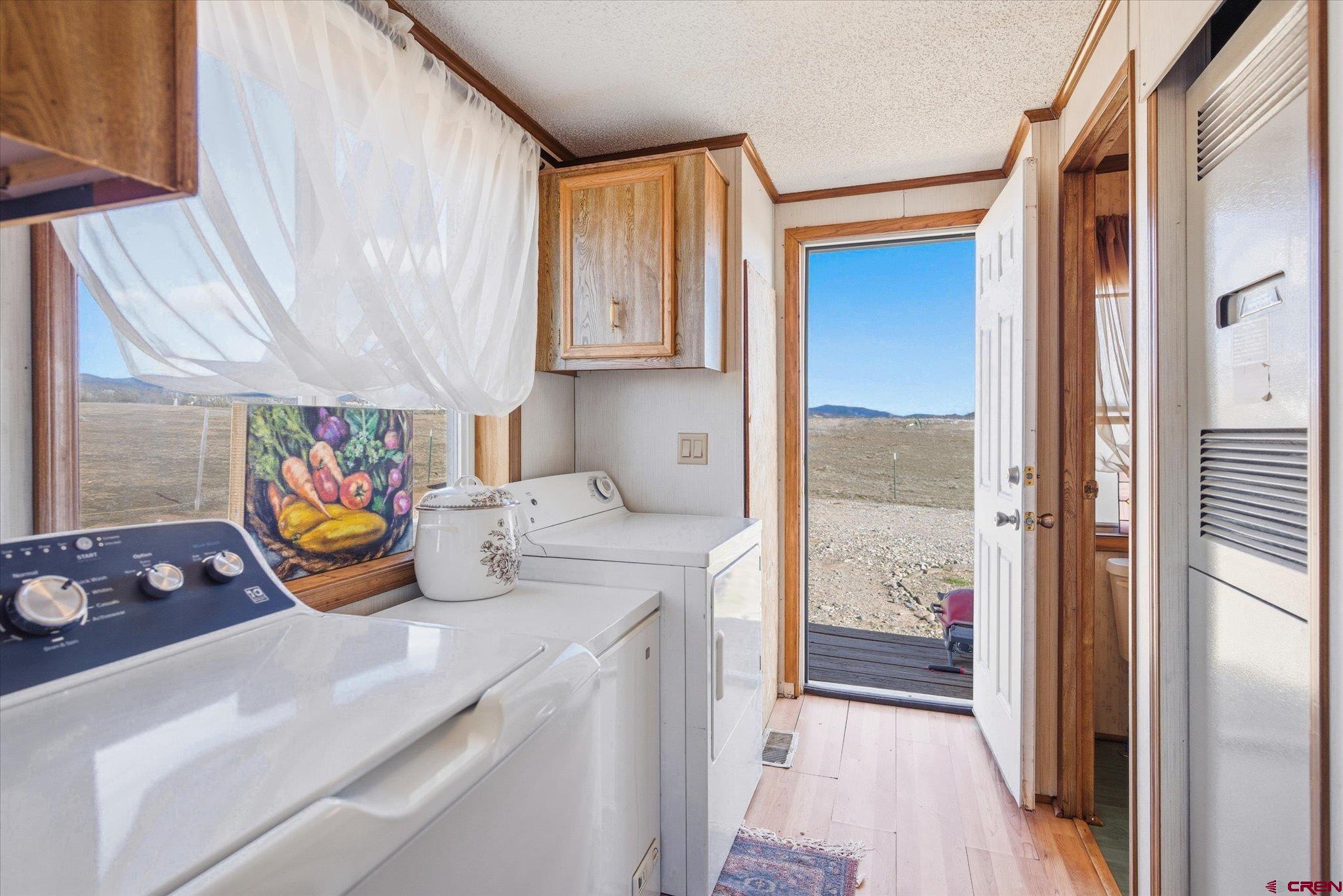 1966 County Road 321 Ignacio, CO 81137 - Photo 9 of 26 a kitchen with a sink and a refrigerator