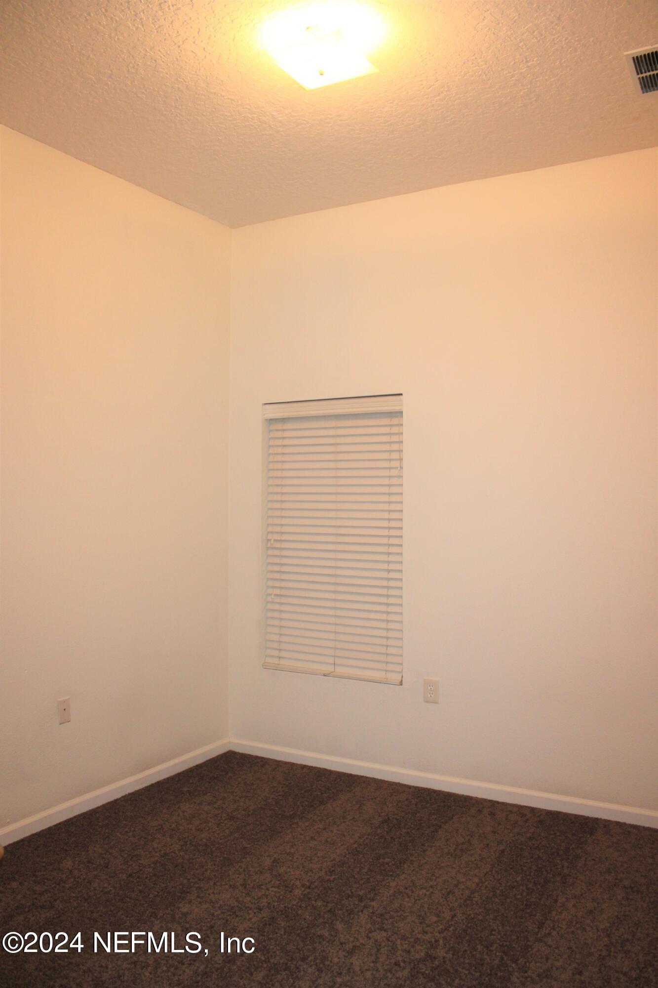 7920 Merrill Road, Unit 1605 Jacksonville, FL 32277 - Photo 8 of 15 a view of an empty room