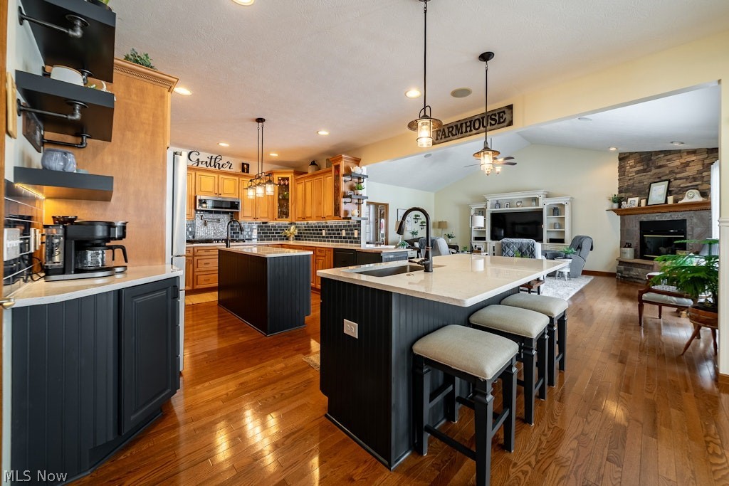 41341 Ravines Edge Way Lagrange, OH 44050 - Photo 11 of 50 In 2020 the kitchen walls were opened up and kitchen redesigned to include two Islands, the second Island is a 3 stool breakfast bar. Both islands have prep sinks & a undercounter Hydroviv water filter