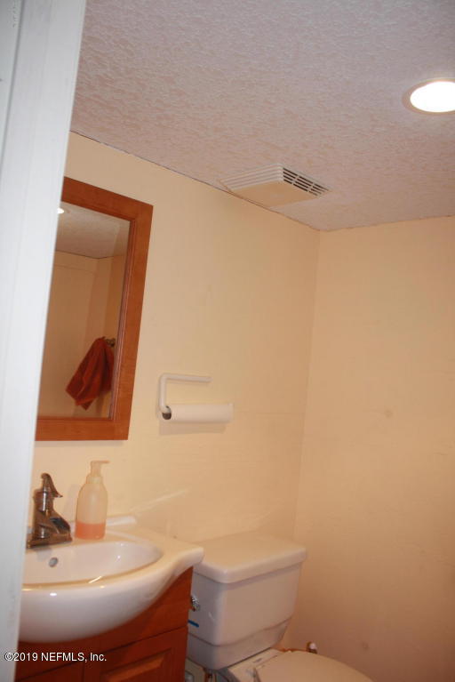 301 Georgetown Shortcut Road Crescent City, FL 32112 - Photo 17 of 108 a bathroom with a sink and a mirror