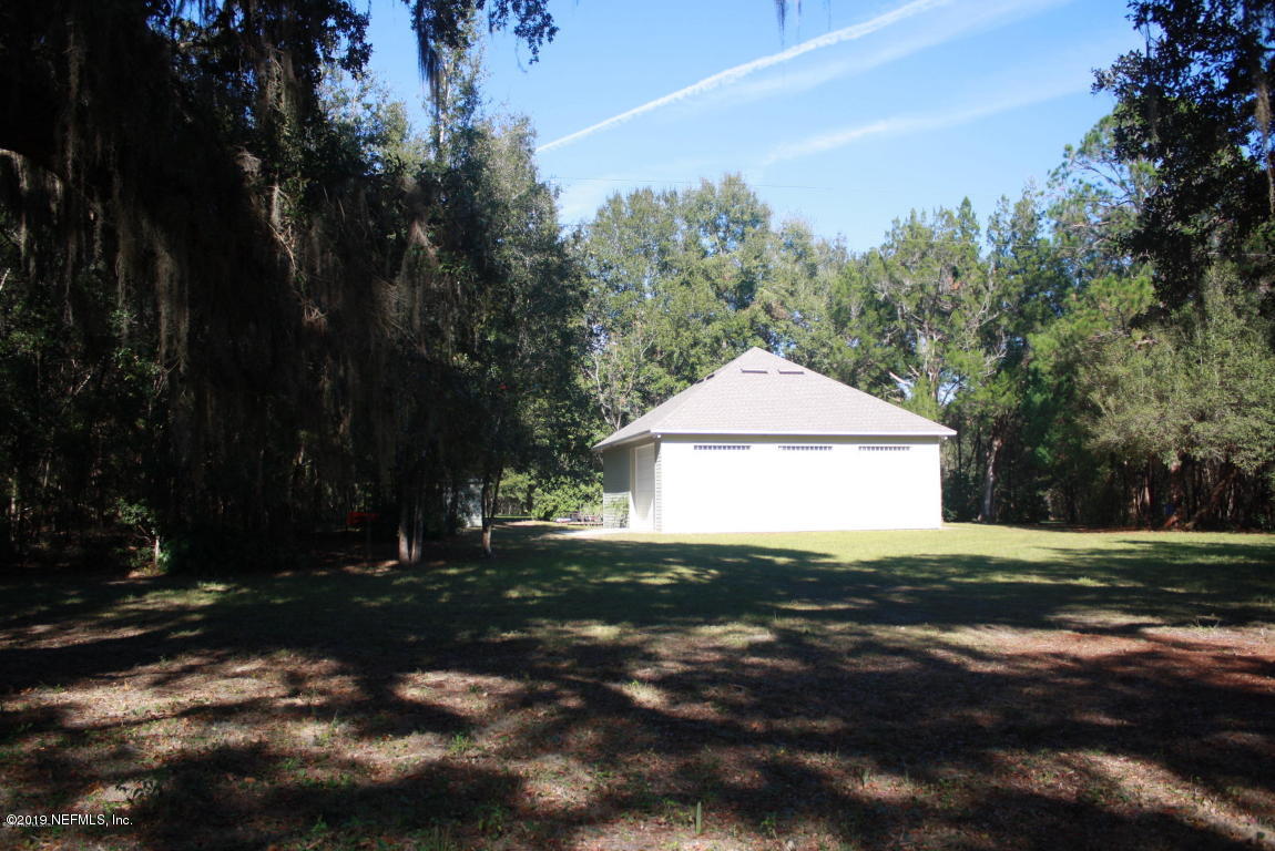 301 Georgetown Shortcut Road Crescent City, FL 32112 - Photo 71 of 108 a view of a house with a yard and tree s