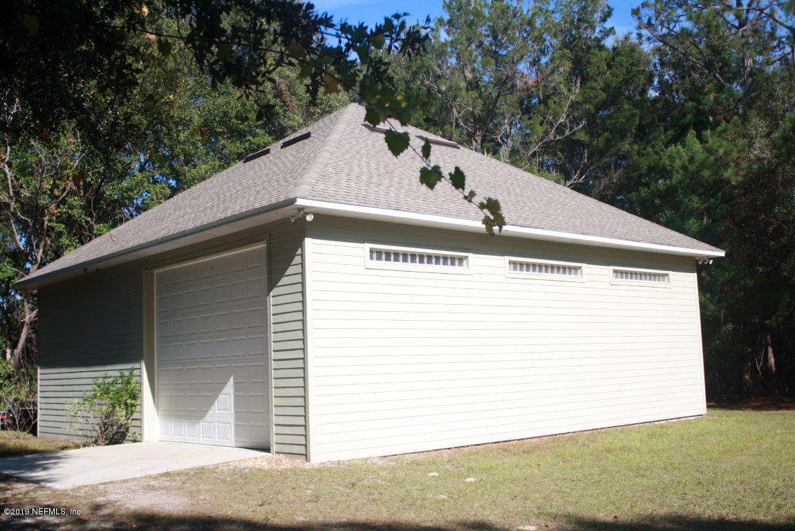 301 Georgetown Shortcut Road Crescent City, FL 32112 - Photo 72 of 108 a view of a house with a garage