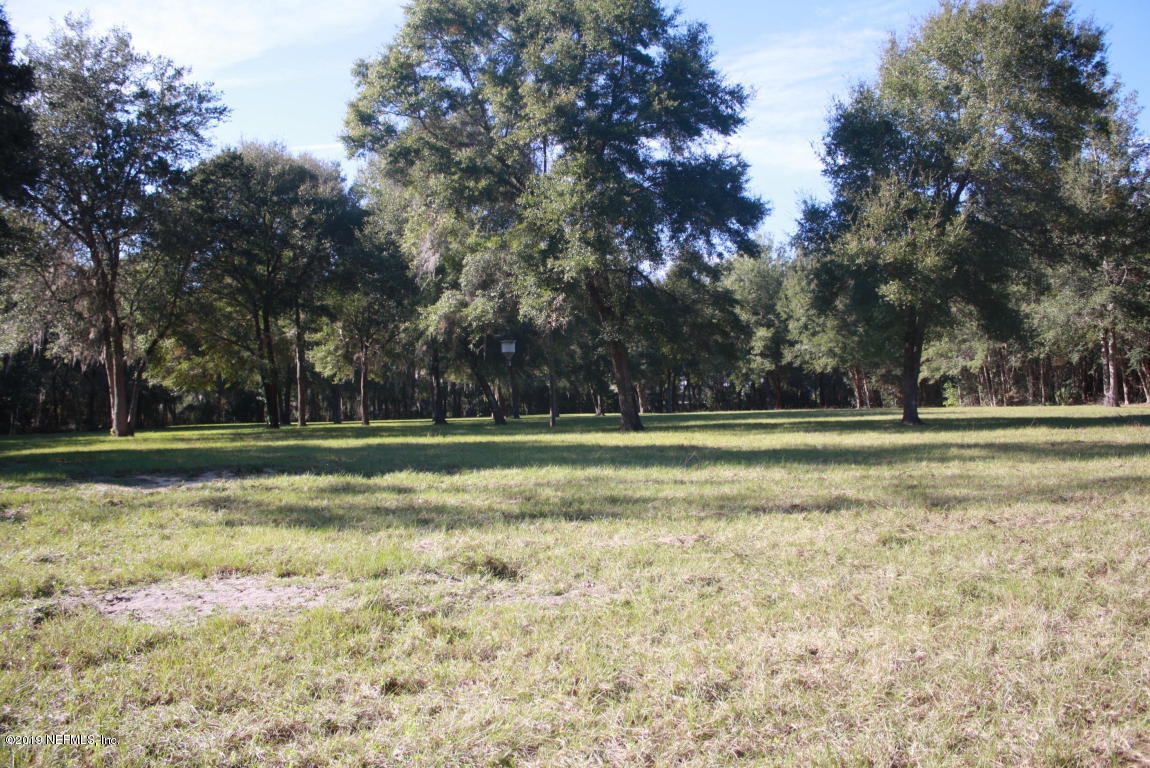 301 Georgetown Shortcut Road Crescent City, FL 32112 - Photo 84 of 108 a view of outdoor space with deck and trees