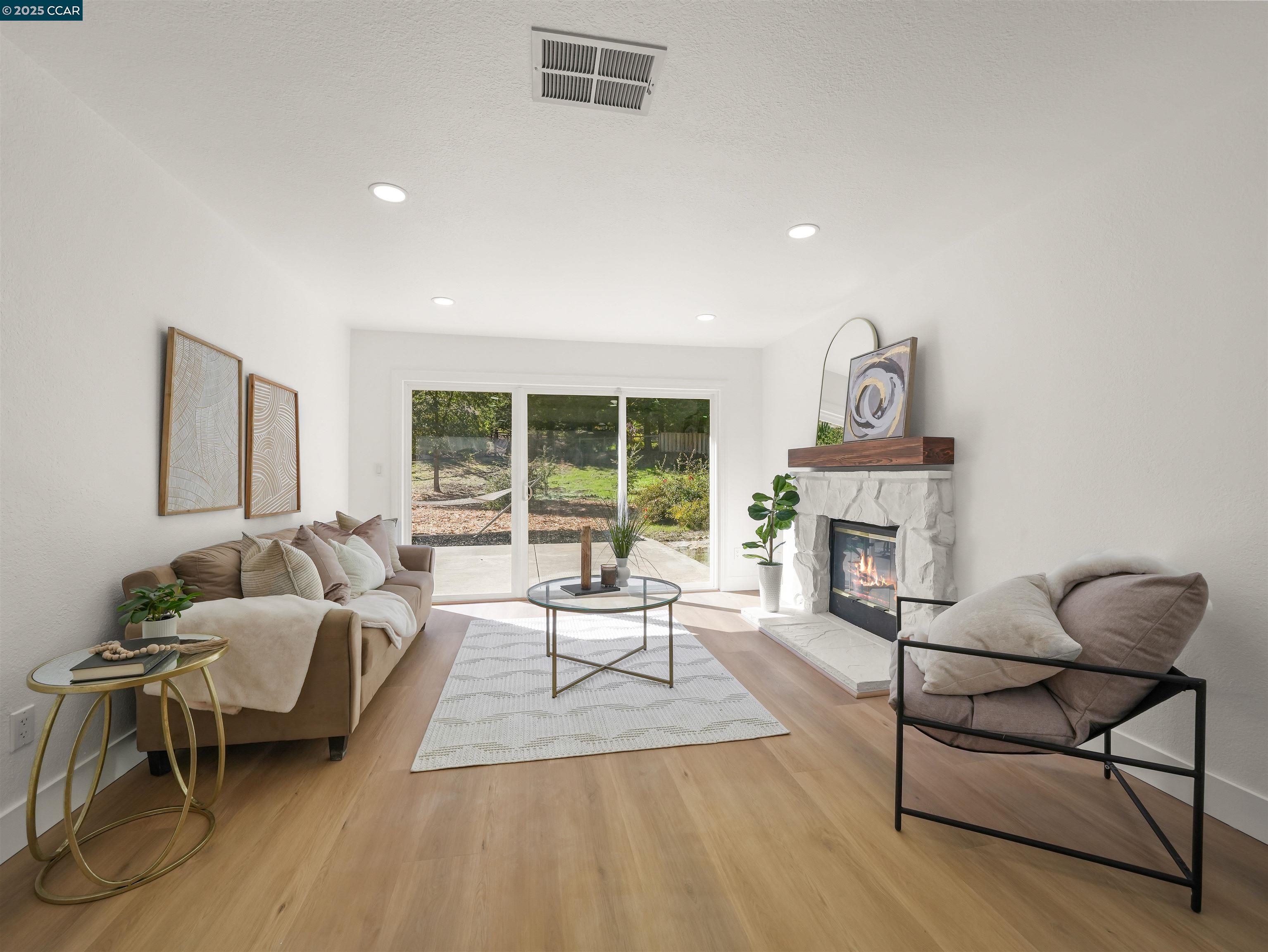 2482 Wildhorse Drive San Ramon, CA 94583 - Photo 16 of 41 a living room with furniture and a fireplace