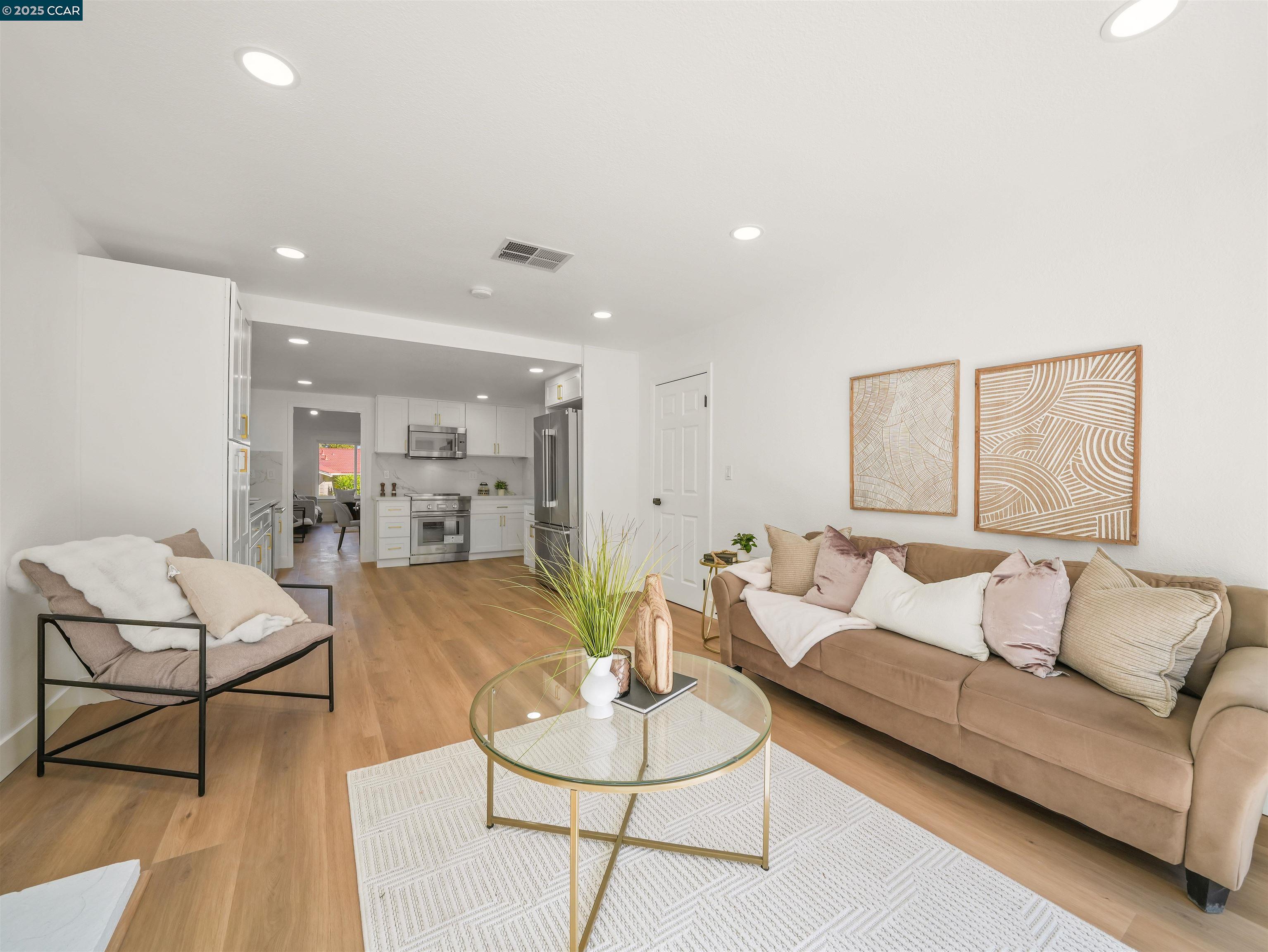 2482 Wildhorse Drive San Ramon, CA 94583 - Photo 17 of 41 a living room with furniture and kitchen view