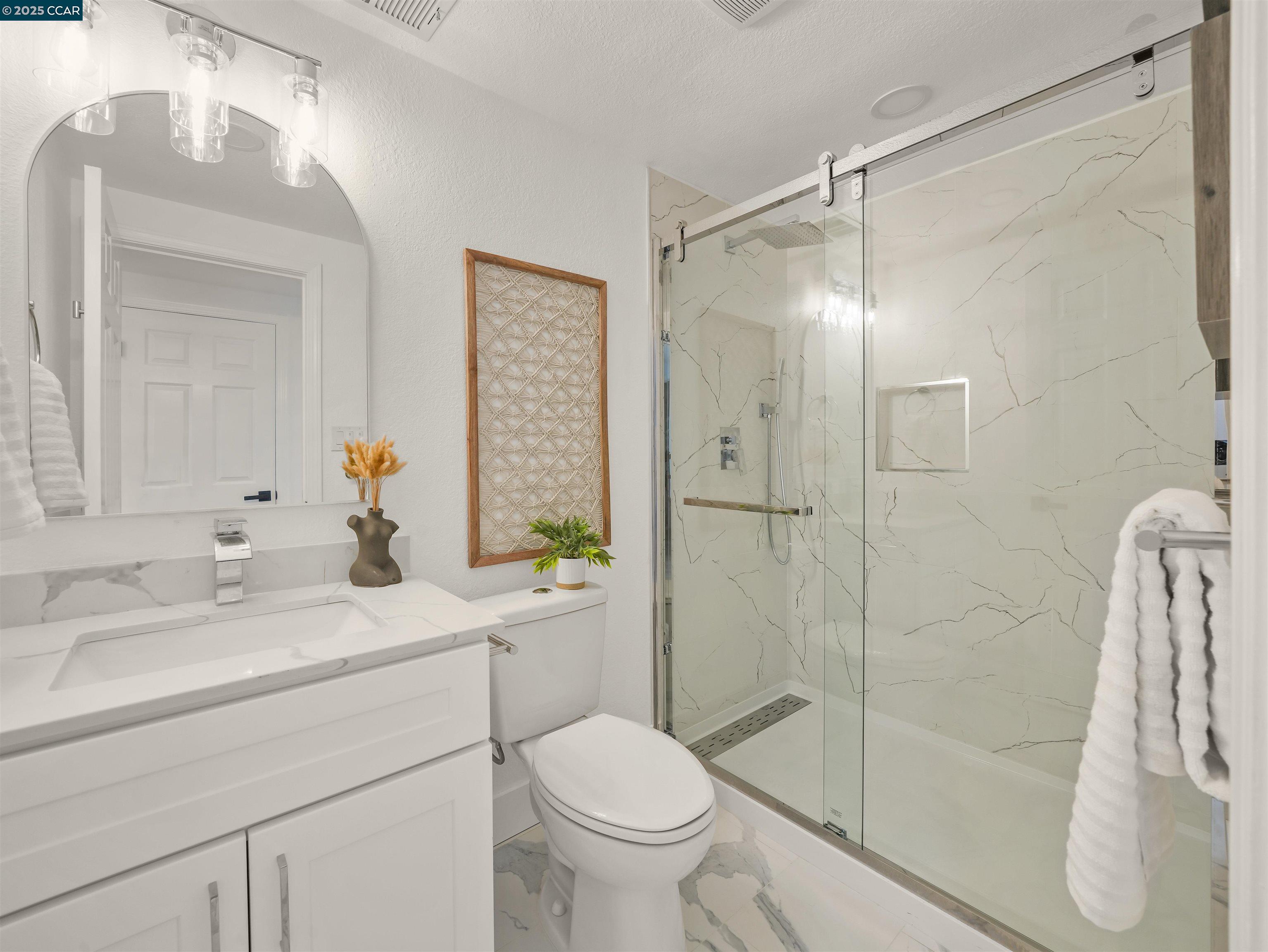 2482 Wildhorse Drive San Ramon, CA 94583 - Photo 18 of 41 a bathroom with a sink toilet and shower