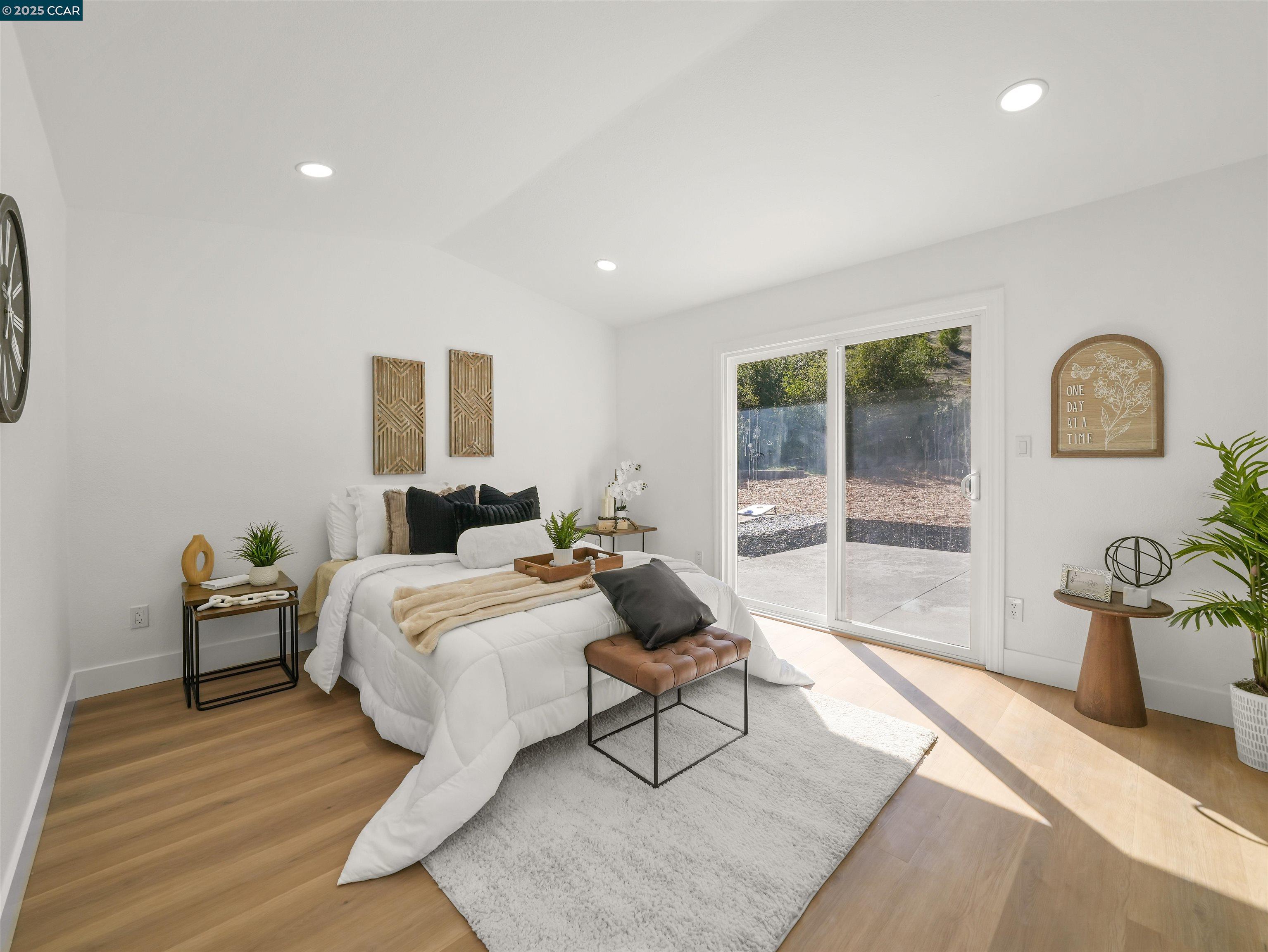 2482 Wildhorse Drive San Ramon, CA 94583 - Photo 19 of 41 a spacious bedroom with a bed and glass door