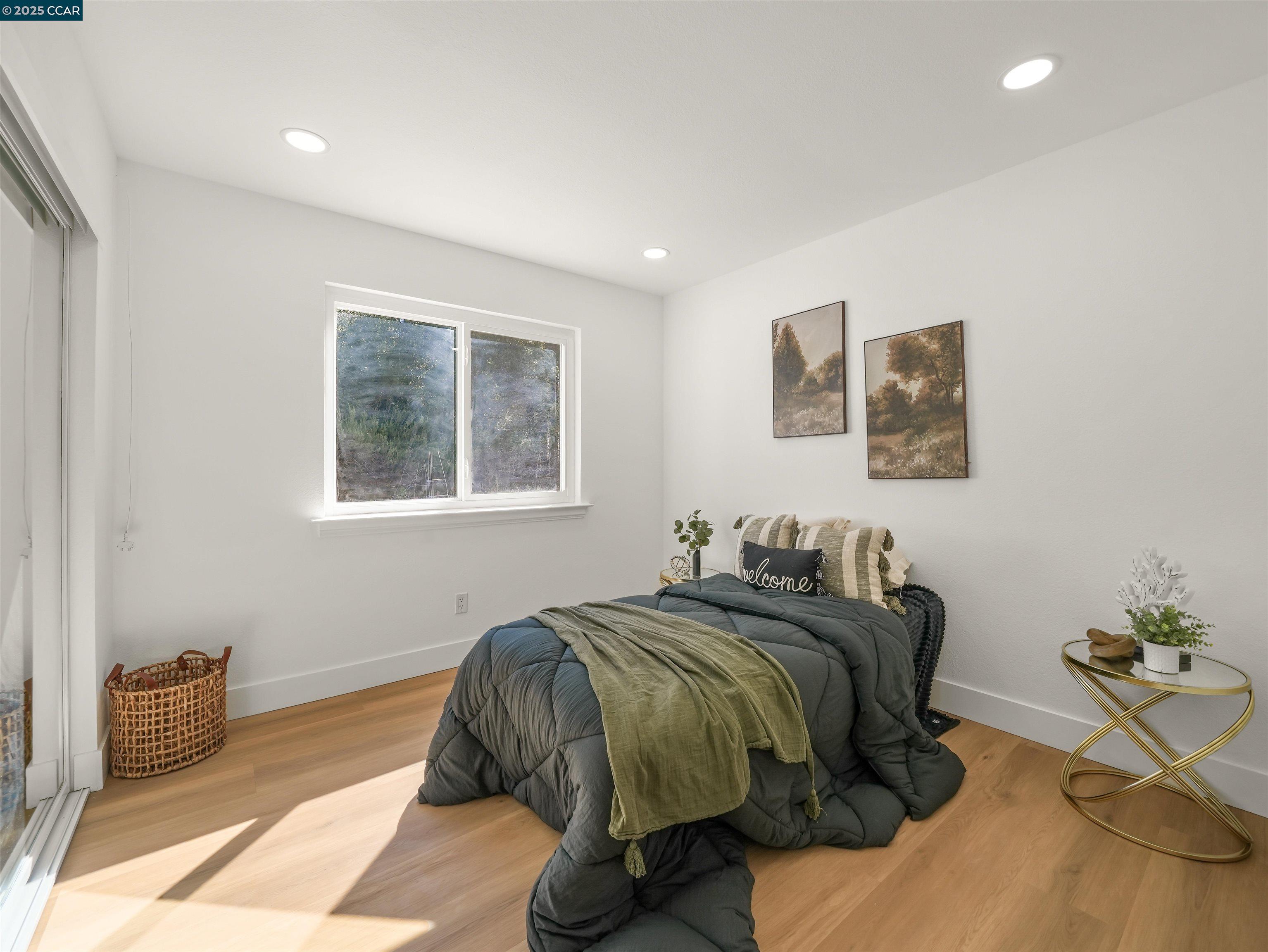 2482 Wildhorse Drive San Ramon, CA 94583 - Photo 22 of 41 a bedroom with a bed and a painting on the wall