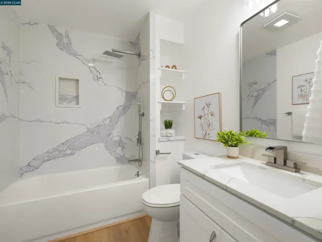 a bathroom with a sink a toilet and a bathtub