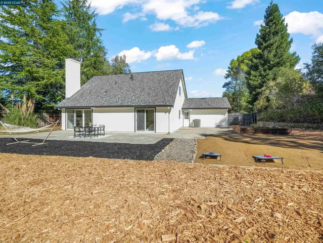 a view of pool with a yard