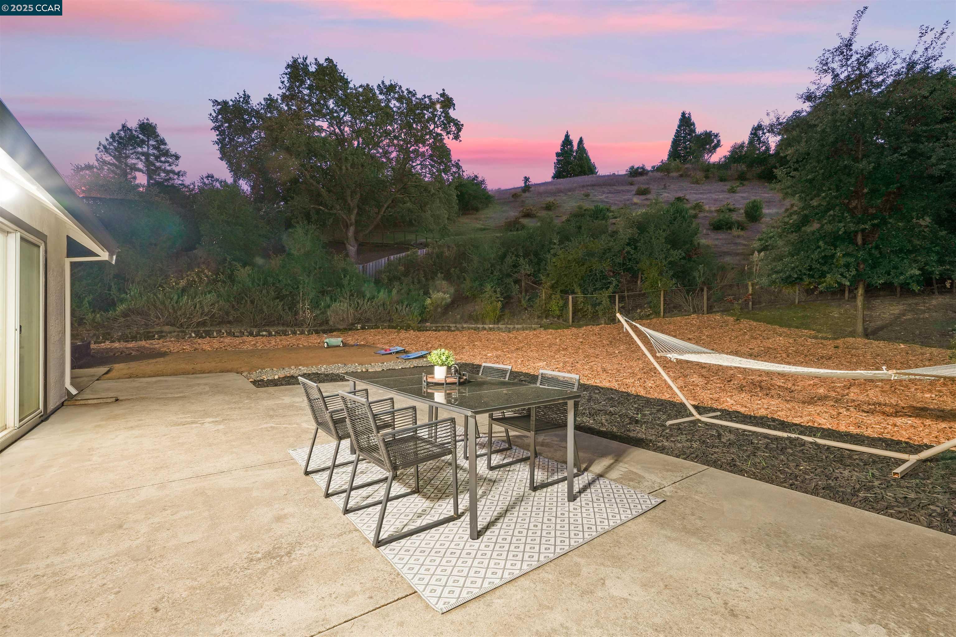 2482 Wildhorse Drive San Ramon, CA 94583 - Photo 35 of 41 a view of a patio with a table and chairs under an umbrella