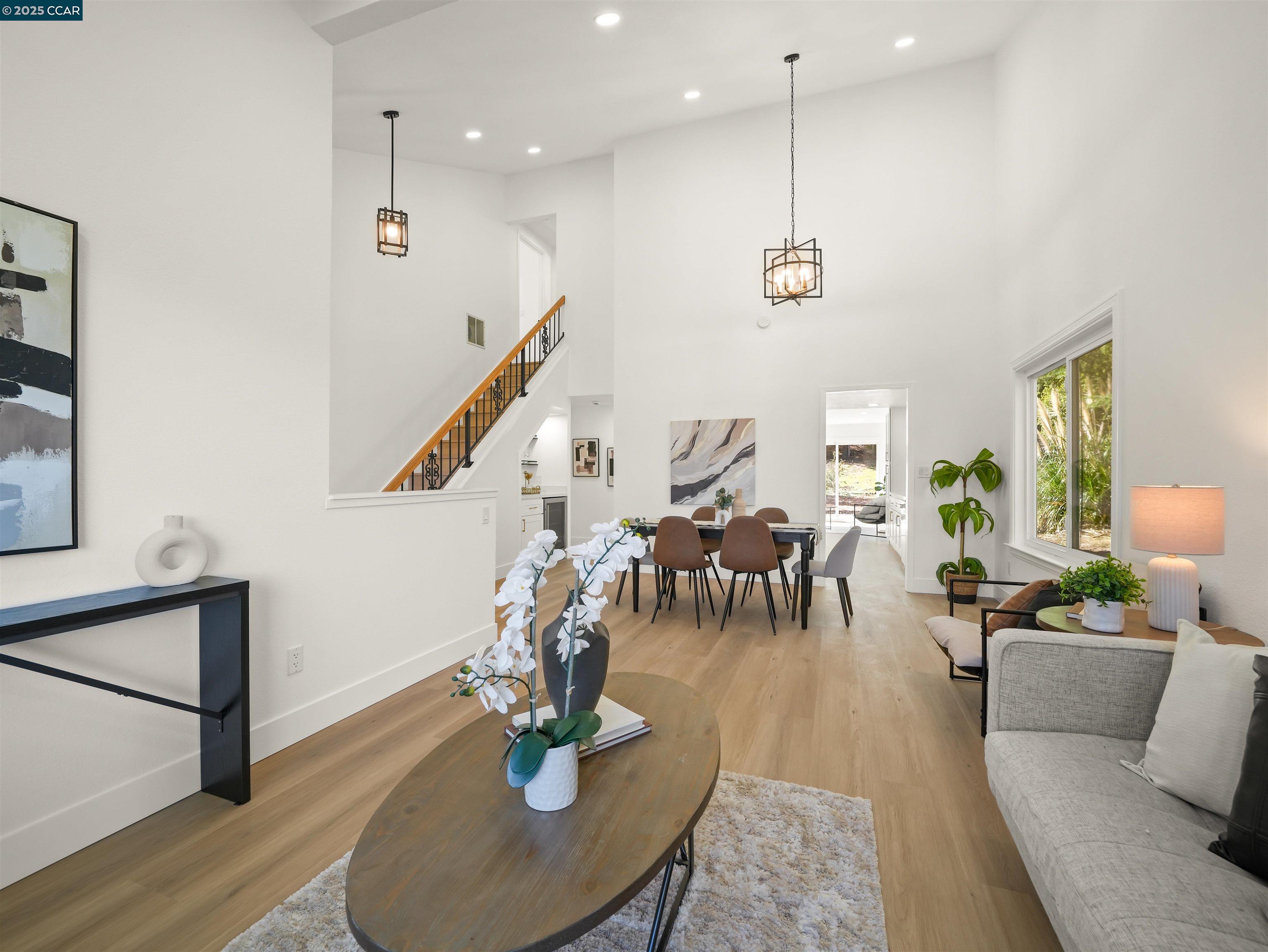 2482 Wildhorse Drive San Ramon, CA 94583 - Photo 6 of 41 a living room with lots of furniture and a wooden floor