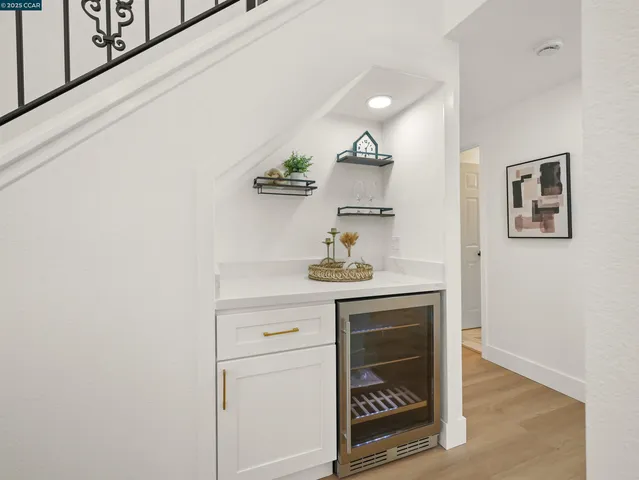 a kitchen with a white cabinets and stove