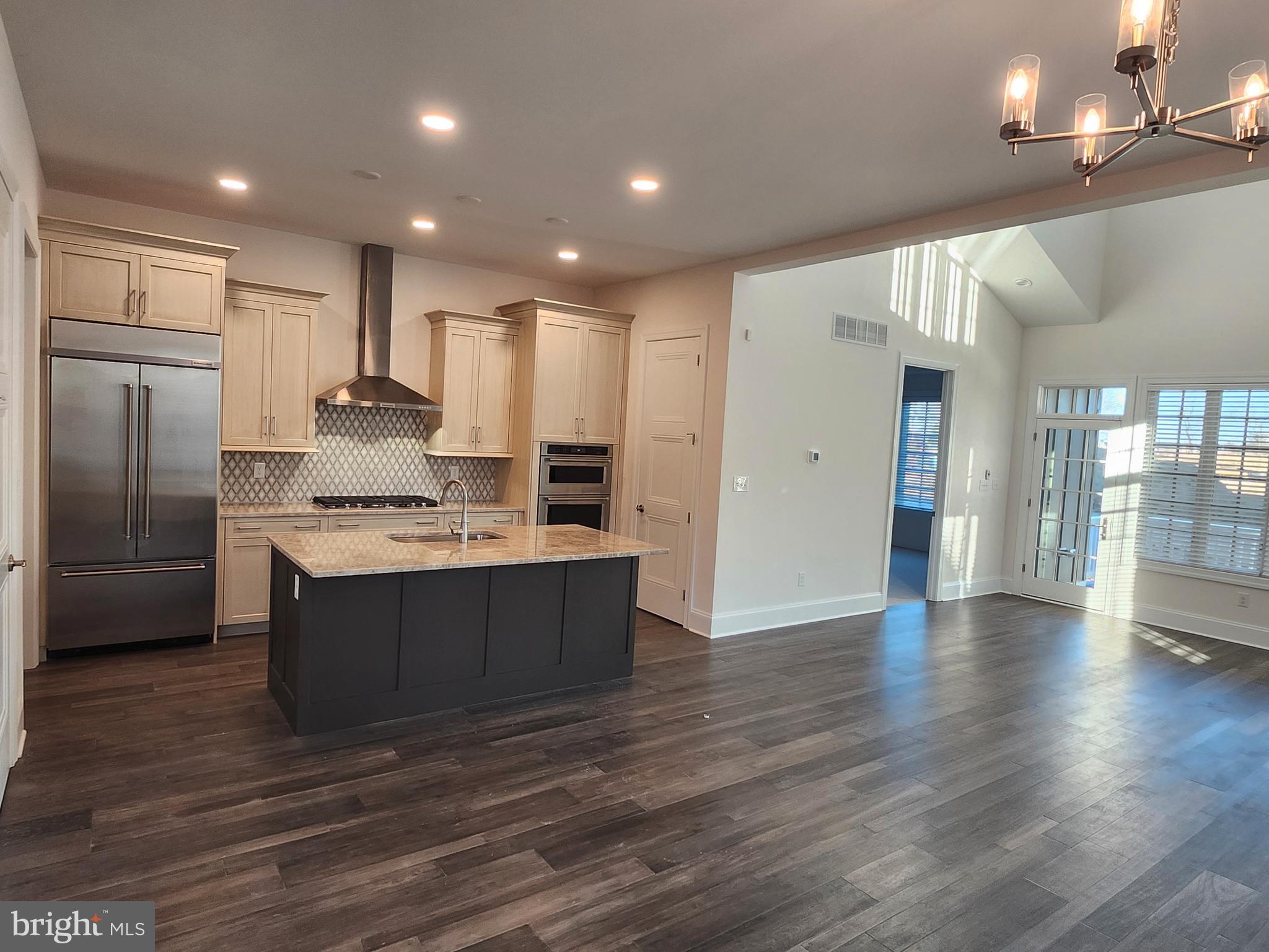 1105 Invermere Road Wilmington, DE 19803 - Photo 4 of 11 a kitchen with stainless steel appliances granite countertop a stove a refrigerator and a sink