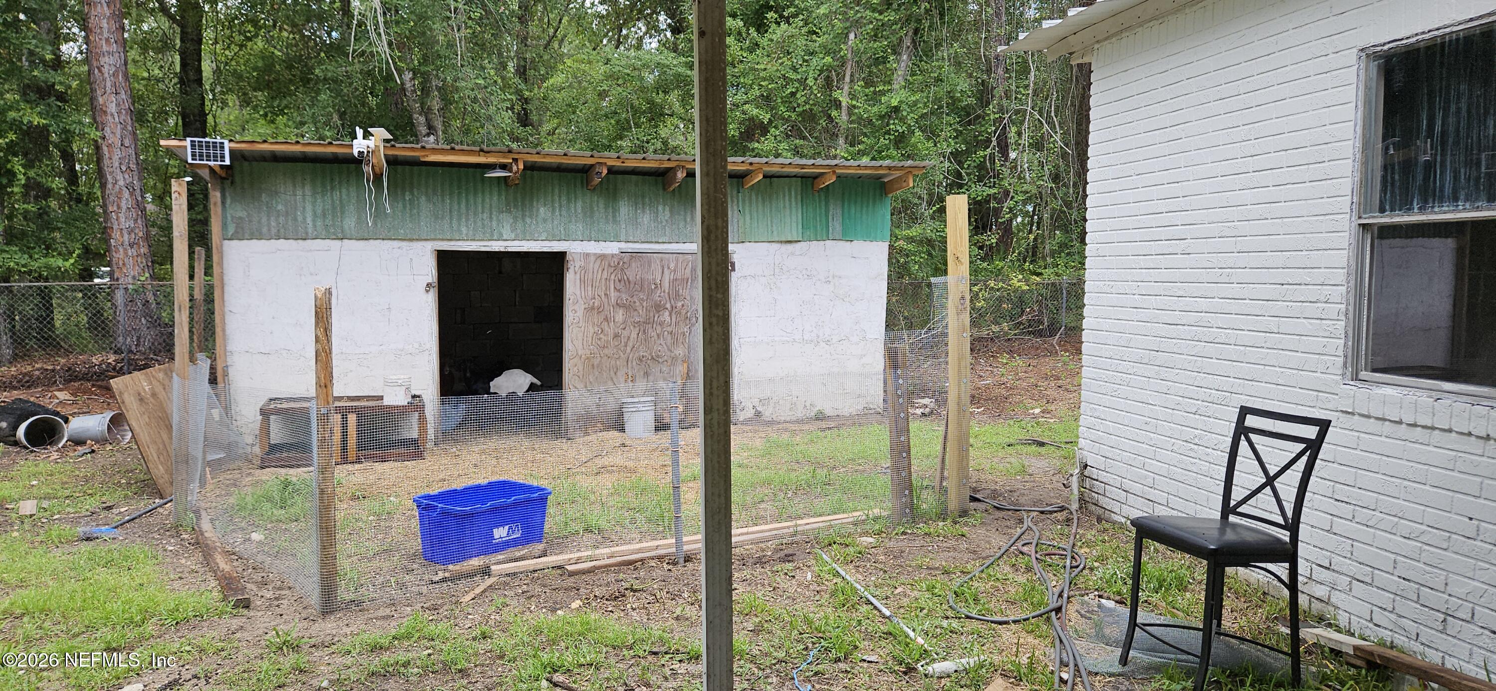 5363 Kilcrease Road Jacksonville, FL 32234 - Photo 25 of 29 a backyard of a house with seating space