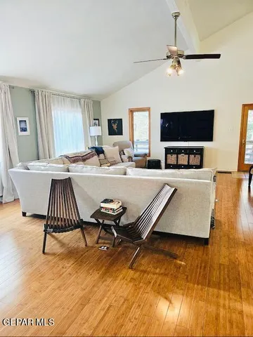 a living room with a flat screen tv and a couch