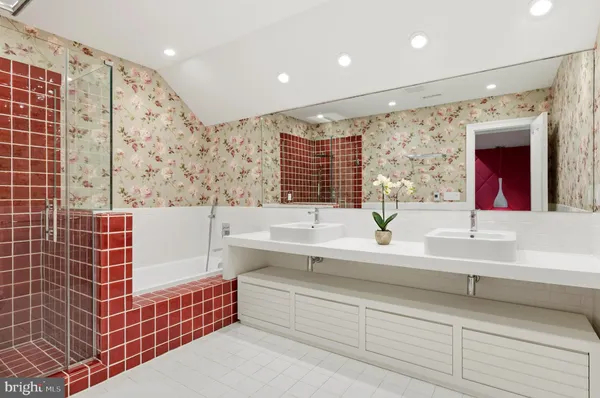 a bathroom with a bathtub and a shower