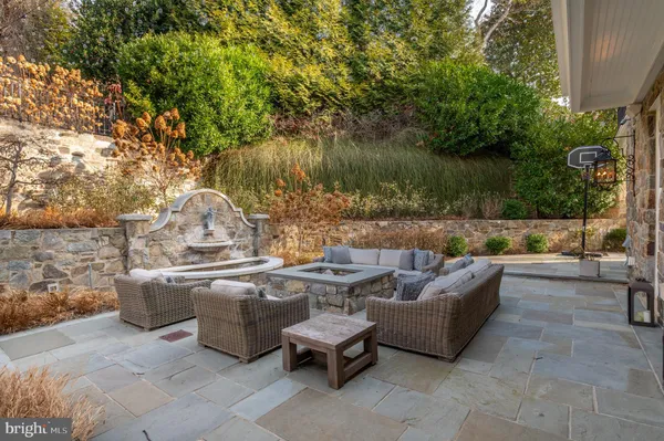 a view of a patio with couches and pool