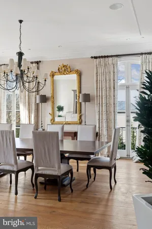 a dining room with furniture and wooden floor