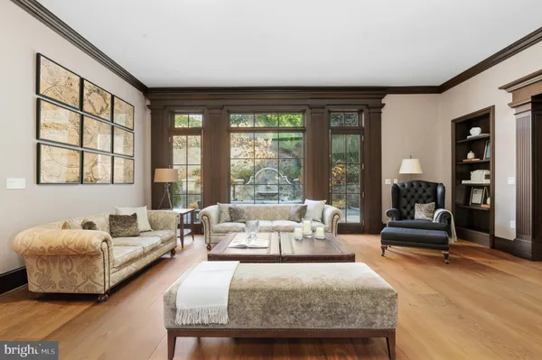 a living room with furniture and large windows