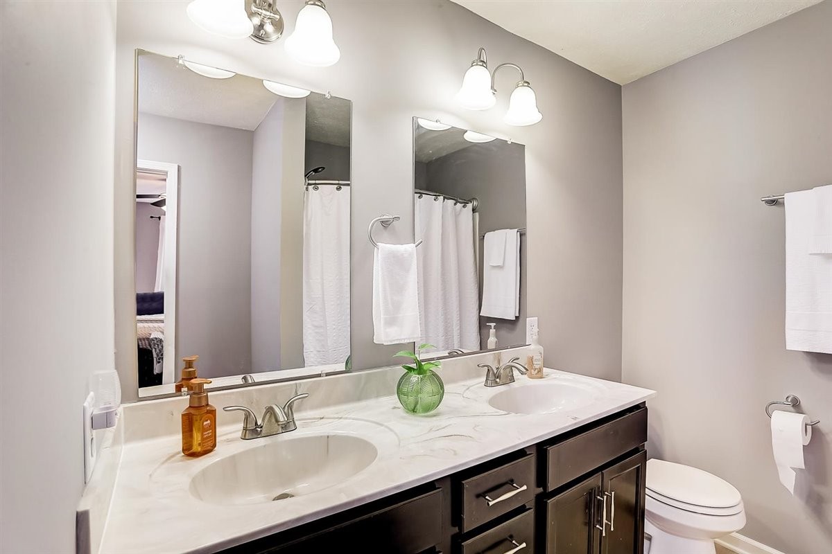 2087 River Road Clarksville, TN 37040 - Photo 17 of 33 a bathroom with a sink vanity granite and a mirror