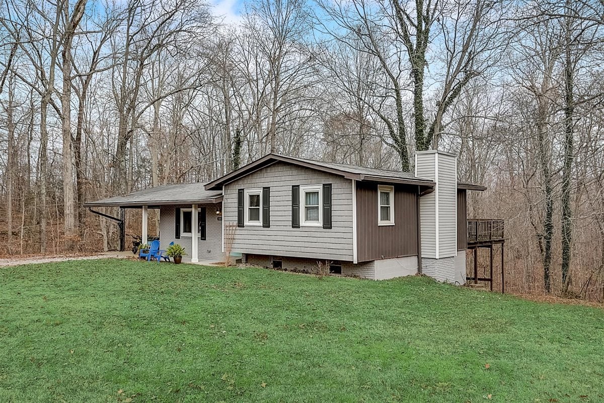 2087 River Road Clarksville, TN 37040 - Photo 3 of 33 a front view of a house with a yard and trees