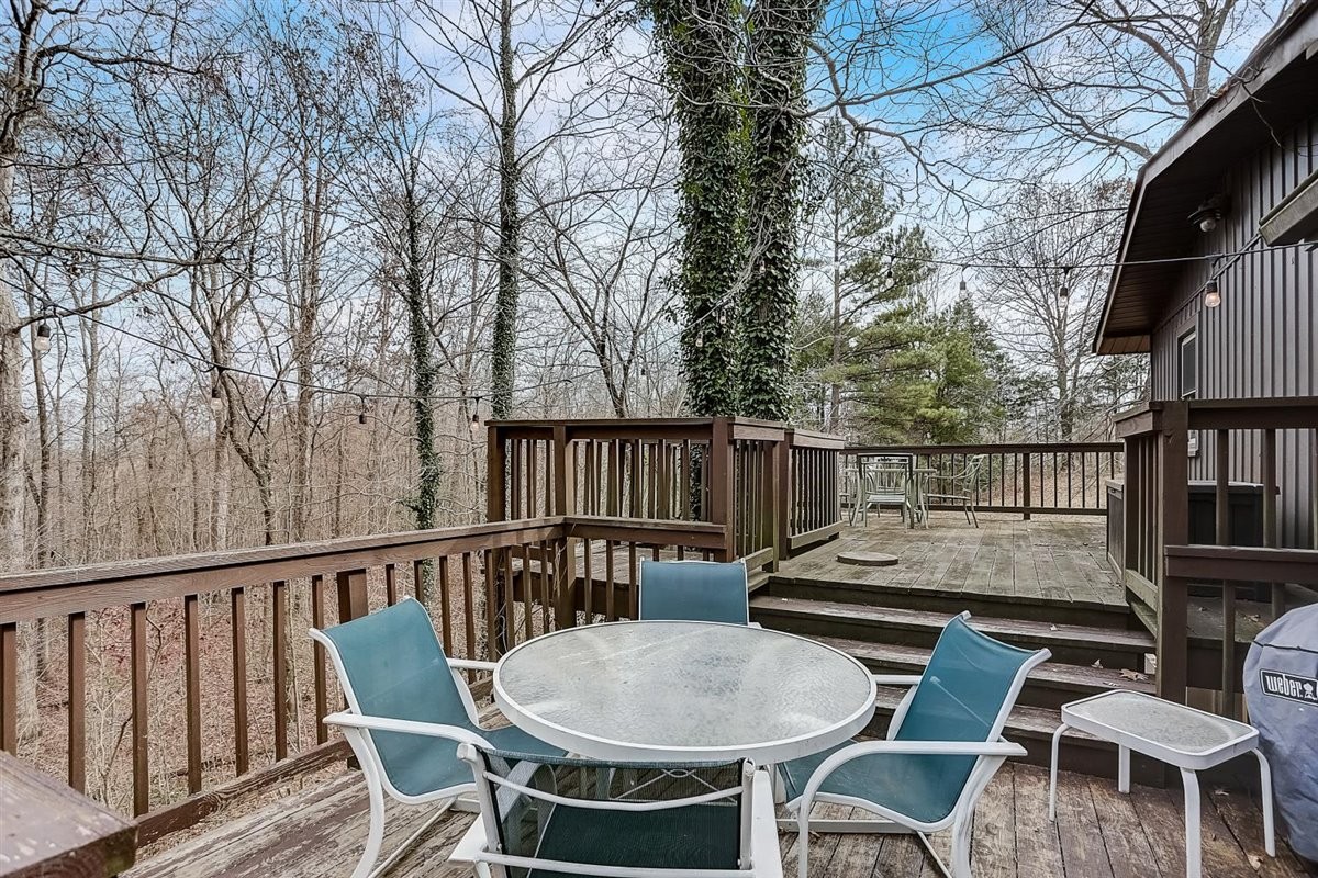 2087 River Road Clarksville, TN 37040 - Photo 26 of 33 a view of a chairs and table on the deck