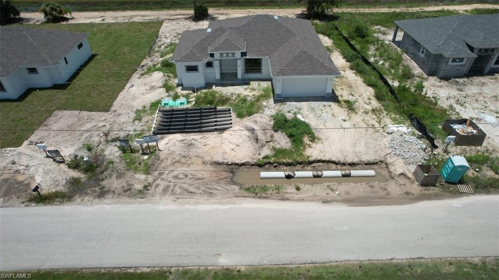 3911 Ordnance Road Lehigh Acres, FL 33971 - Photo 4 of 8 an aerial view of a house with a yard