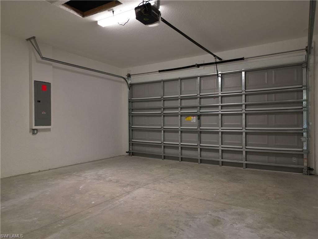 3911 Ordnance Road Lehigh Acres, FL 33971 - Photo 6 of 8 a view of an empty room with a white walls