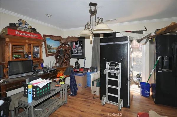 a view of a livingroom with furniture and a window