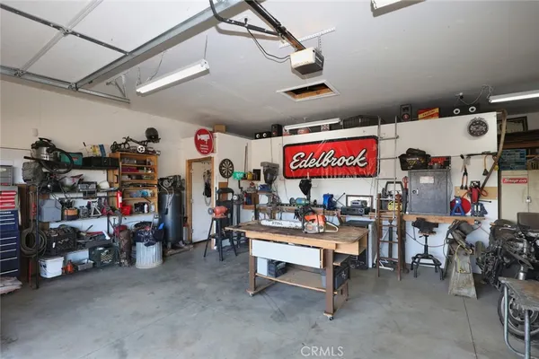 a view of a garage with a lot of stuff