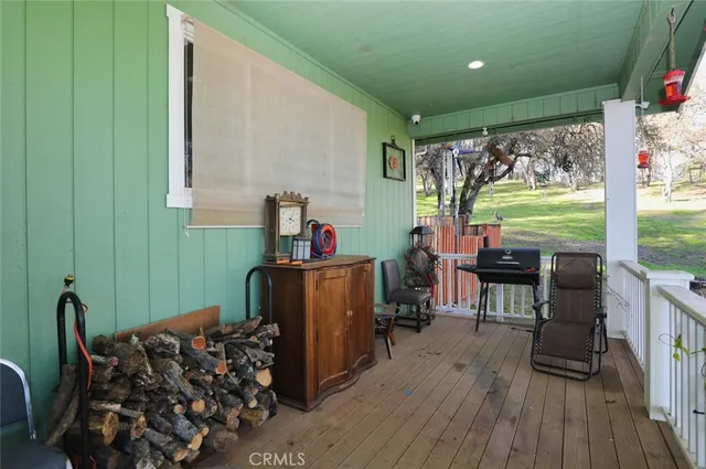 a room with furniture a window and wooden floor
