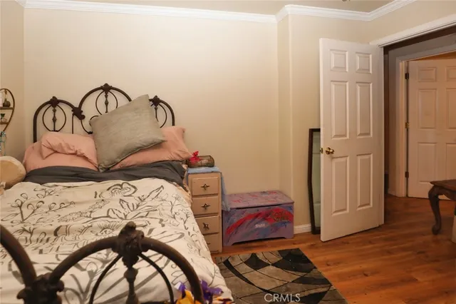 a bedroom with a bed and a closet