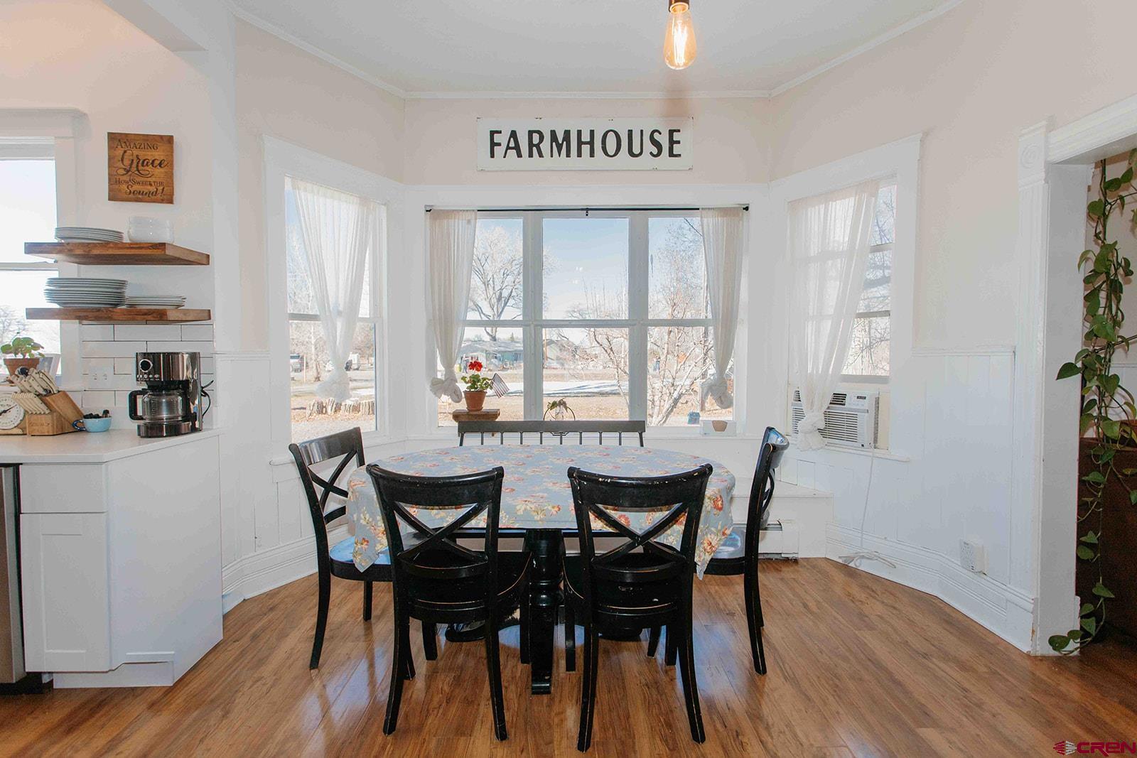 62966 Ohlm Road Montrose, CO 81403 - Photo 5 of 43 a view of a dining room with furniture and wooden floor