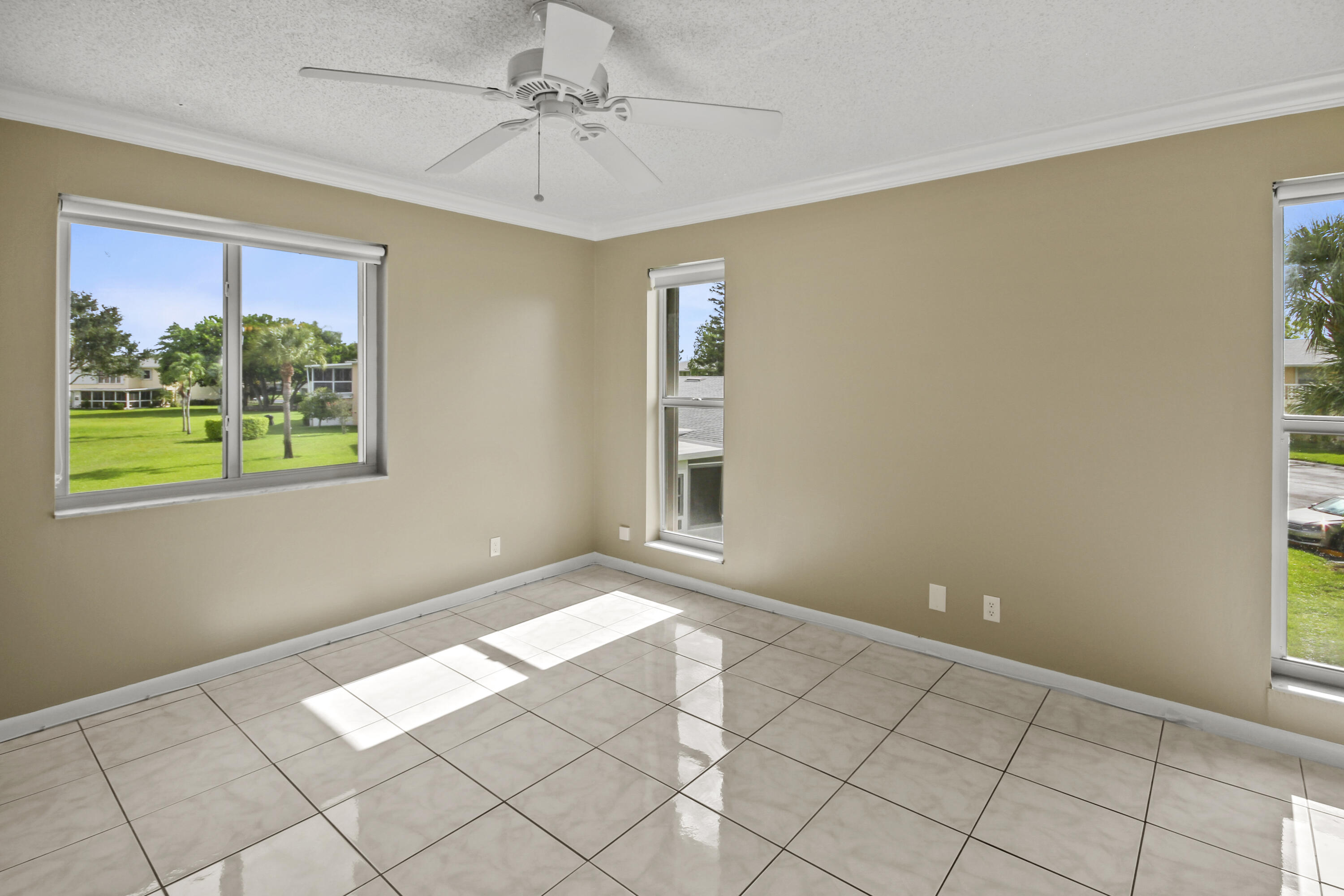 1421 Northwest 20th Avenue, Unit 204 Delray Beach, FL 33445 - Photo 16 of 22 a view of an empty room with a window