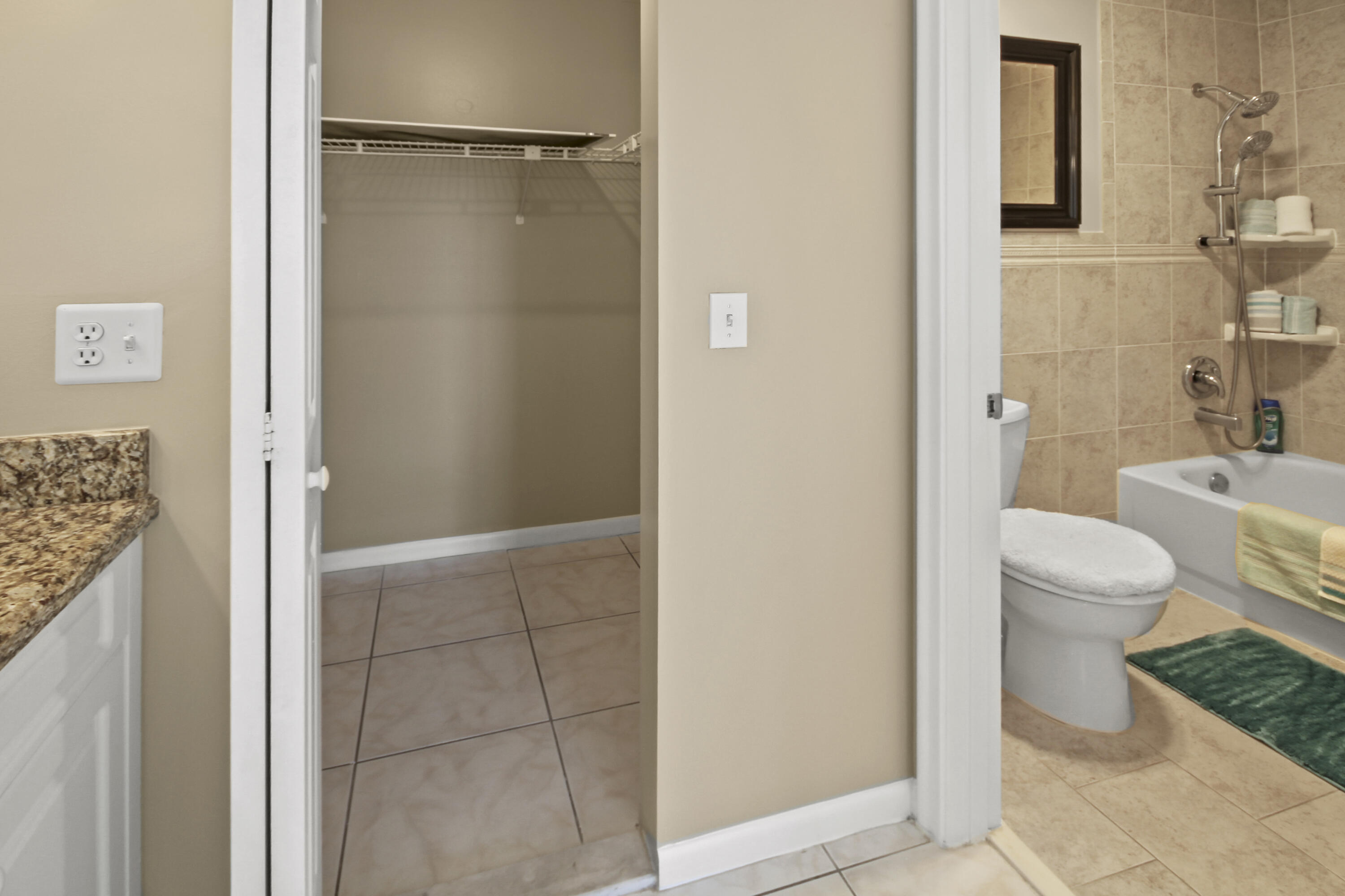 1421 Northwest 20th Avenue, Unit 204 Delray Beach, FL 33445 - Photo 19 of 22 a bathroom with a toilet and a shower